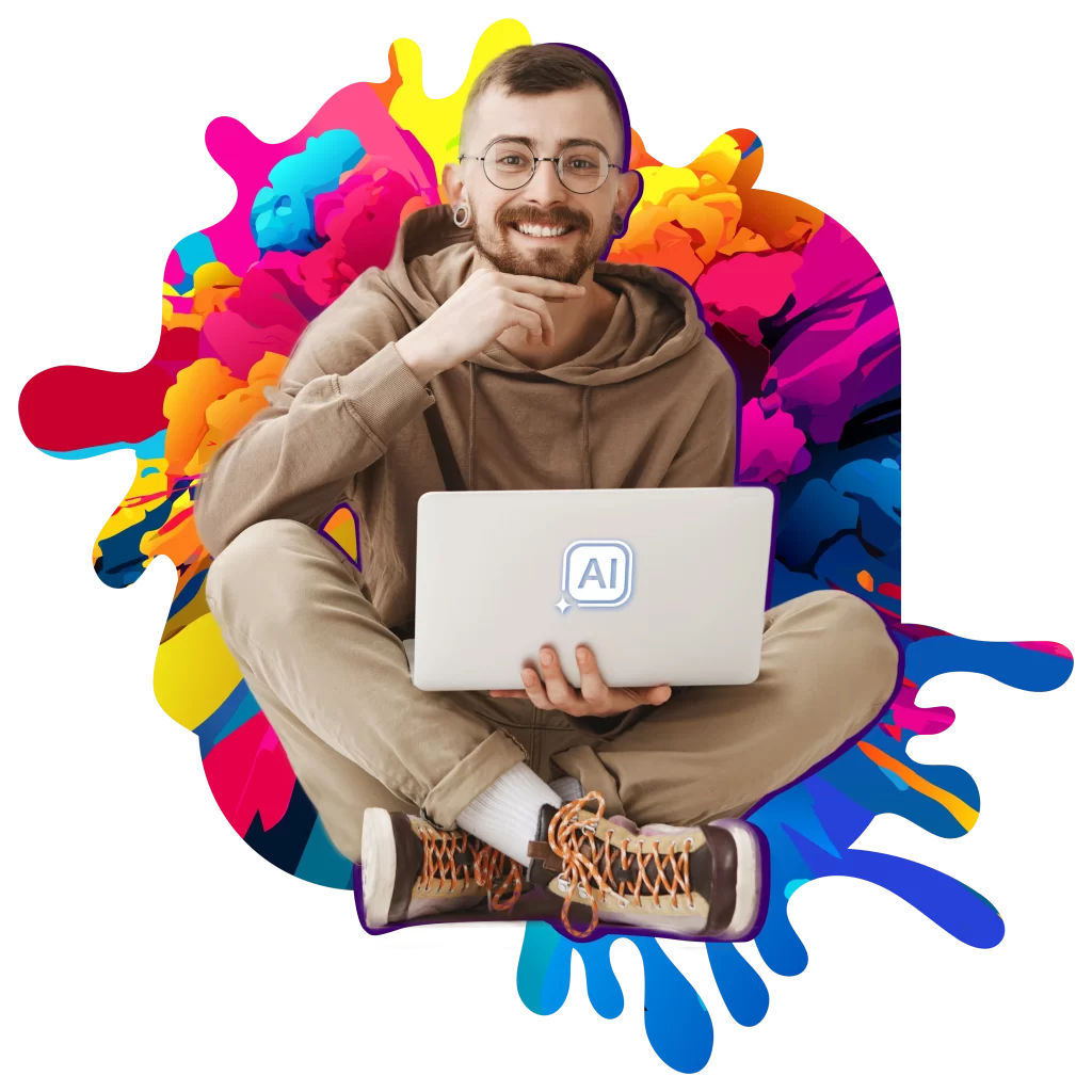 Usměvavý muž s brýlemi a vousy sedící se zkříženýma nohama, držící notebook s logem AI, na barevném abstraktním pozadí